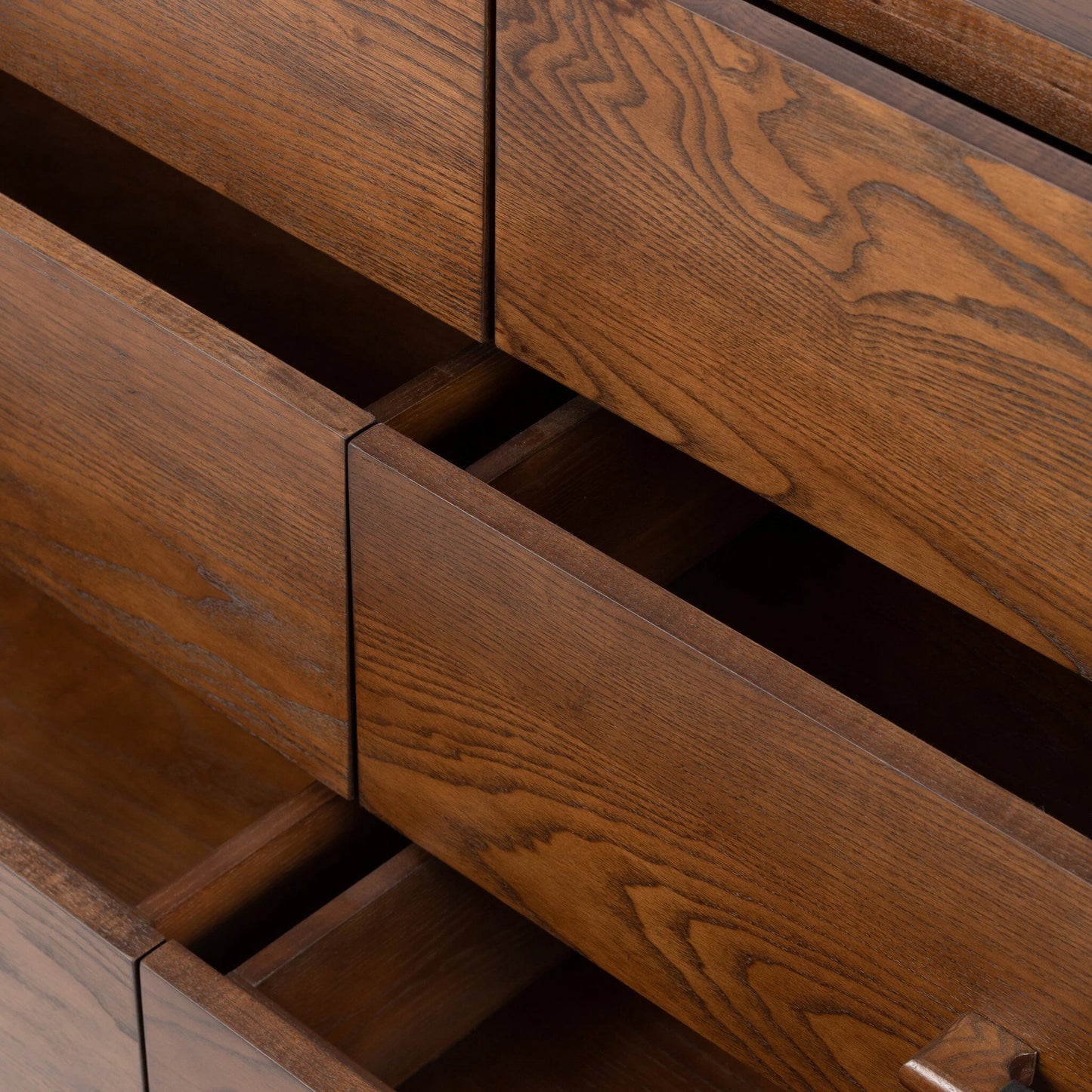 011 SI-2001419 | Closeup | Halston 6 Drawer Dresser by Four Hands in terra brown ash. Made from solid ash, ash veneer, top grain leather in a modern style.