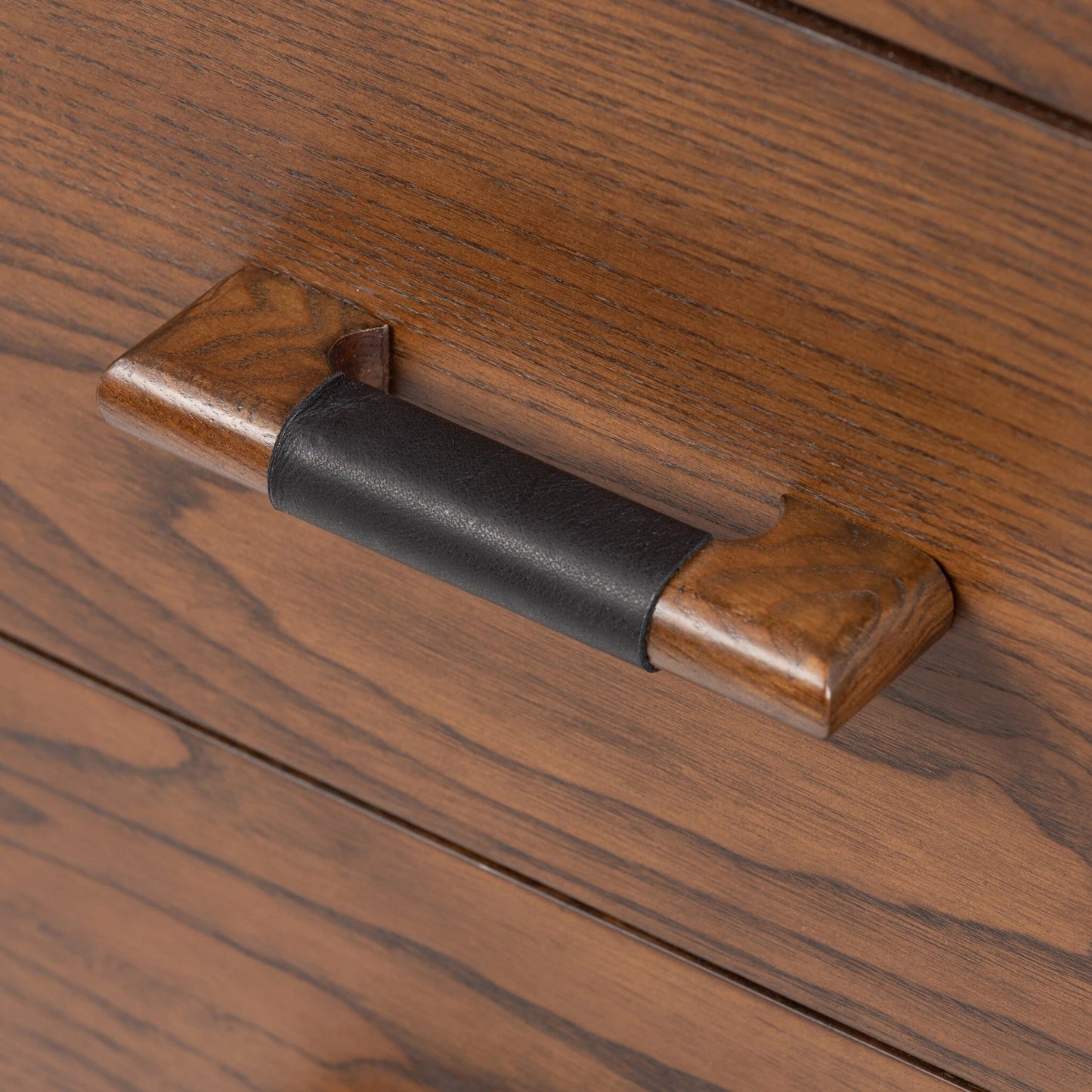 013 SI-2001419 | Closeup | Halston 6 Drawer Dresser by Four Hands in terra brown ash. Made from solid ash, ash veneer, top grain leather in a modern style.
