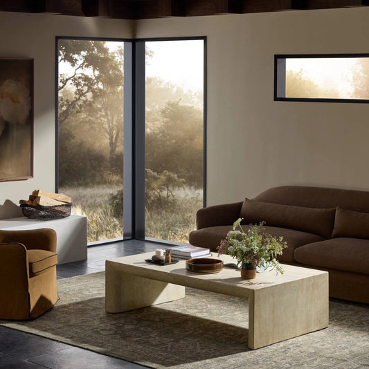 Brad Coffee Table by Four Hands in faux travertine. Made from solid concrete in a transitional style.