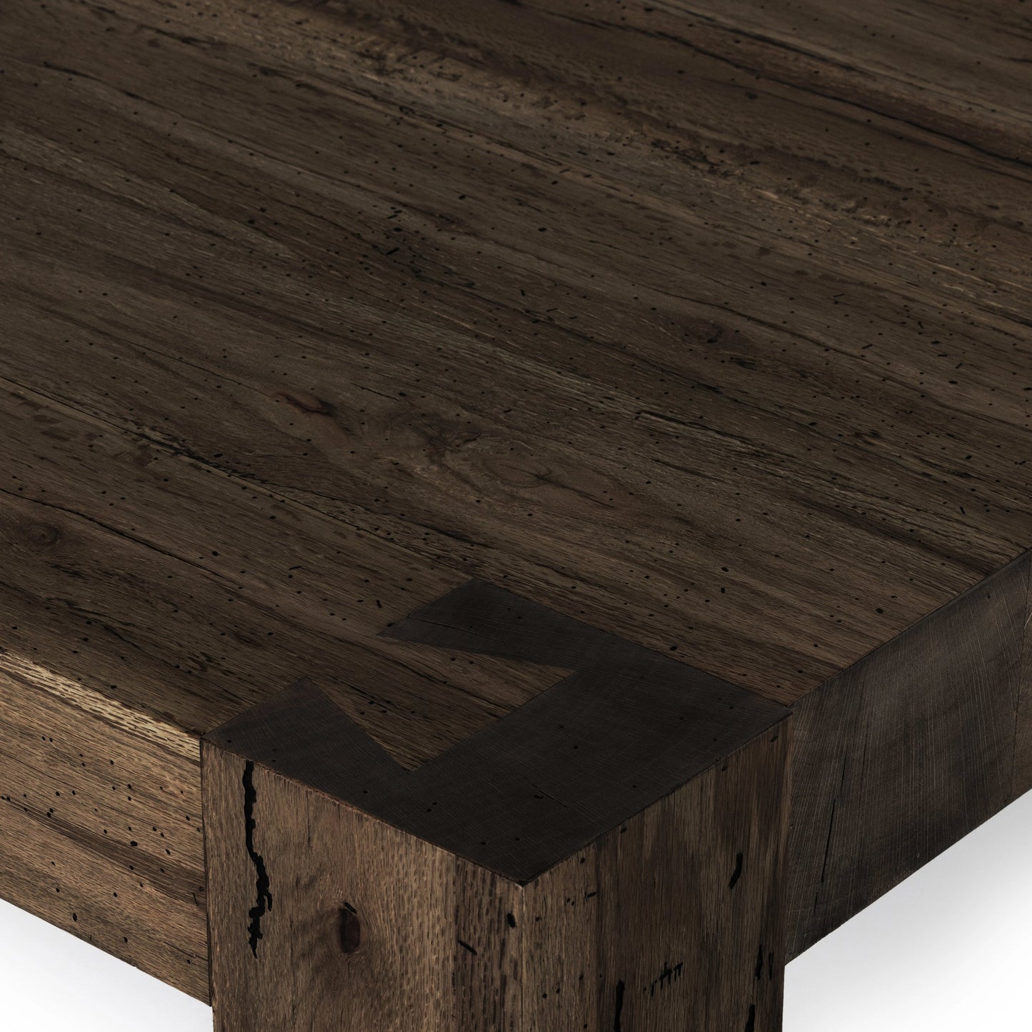 006 SI-1976980 | Closeup | Abaso Coffee Table by Four Hands in ebony rustic wormwood oak. Made from thick oak veneer, engineered hardwood in a transitional style.