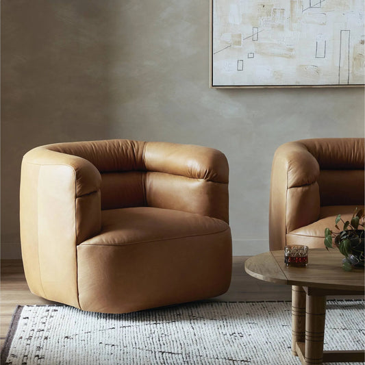 Gerrie Swivel Chair by Four Hands in brickhouse butterscotch. Made from top grain leather in a traditional style.