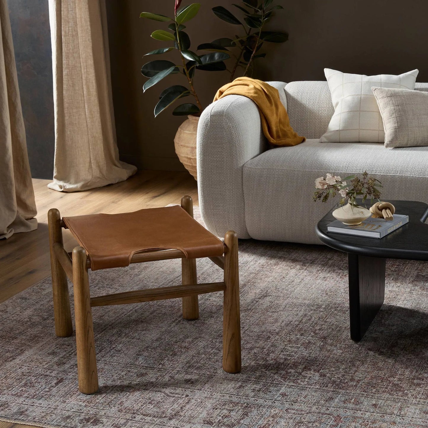 011 SI-2001738 | Lifestyle | Nino Ottoman by Four Hands in dakota tobacco. Made from top grain leather, solid nettlewood, 100% polyester in a modern style.
