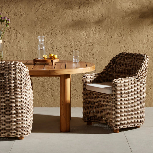 Messina Outdoor Dining Armchair by Four Hands in venao ivory, natural teak-fsc, chunky sand woven. Made from 100% olefin, solid fsc®-certified teak, 100% polyethylene in a cottage & farmhouse style.