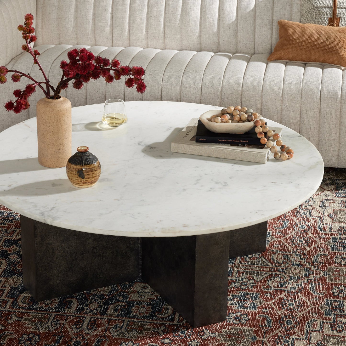 010 SI-1977850 | Lifestyle | Terrell Round Coffee Table by Four Hands in raw black, polished white marble. Made from solid marble, aluminum, engineered hardwood in a modern style.