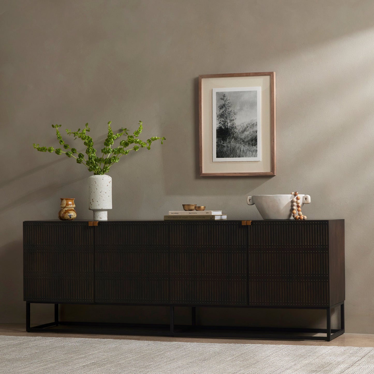 012 SI-1901371 | Lifestyle | Kelby Closed Media Console by Four Hands in aged brass, carved vintage brown, vintage brown, gunmetal. Made from solid mango, iron in a modern style.