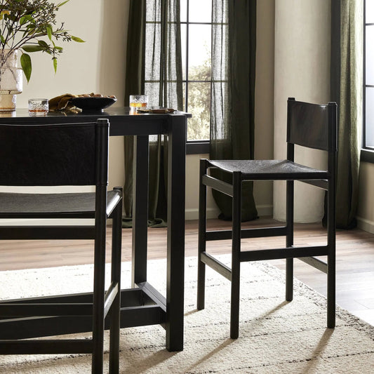 Kena Bar Stool by Four Hands. Made from solid parawood, top grain leather in a modern style.