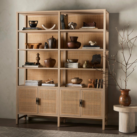 Caprice Wide Bookshelf by Four Hands in natural mango, gunmetal, natural cane and natural mango. Made from solid mango, iron in a modern style.