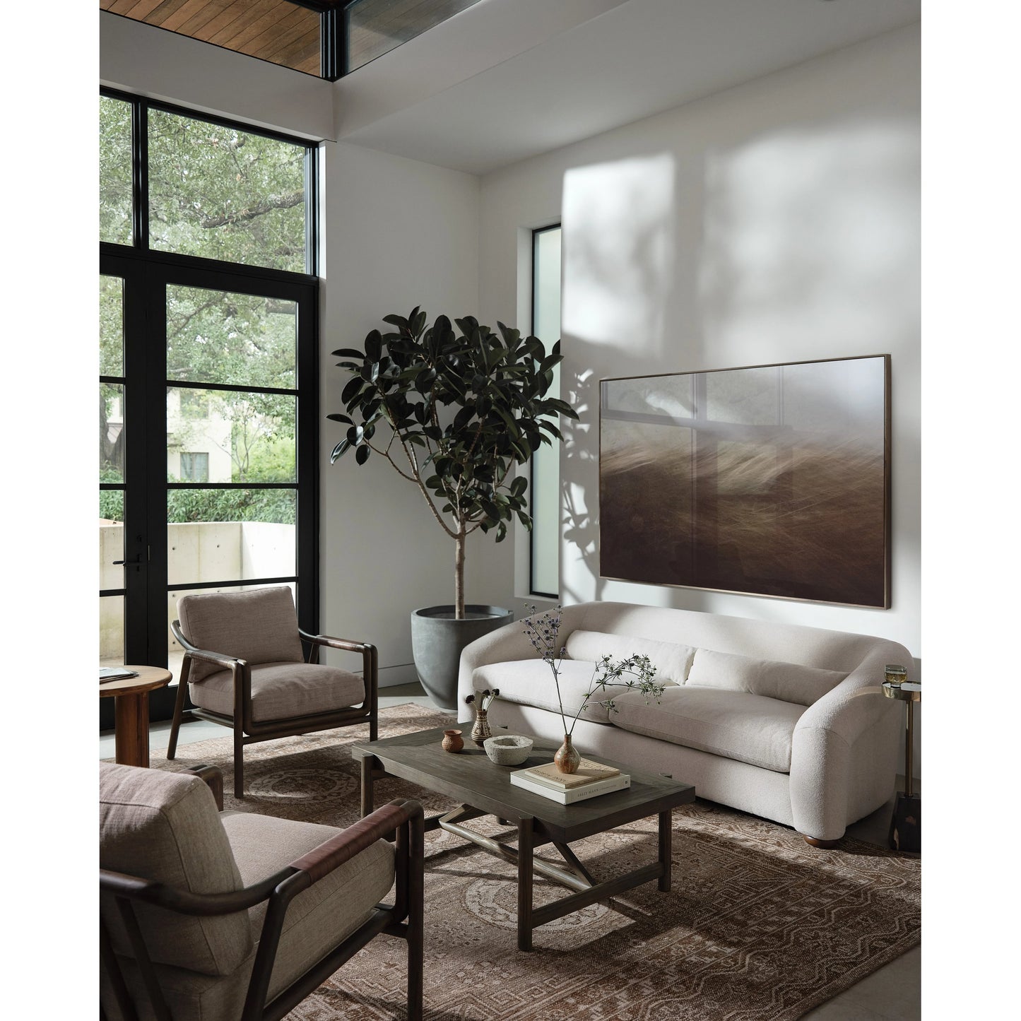 009 SI-1977341 | Lifestyle | Goldthwaite Coffee Table by Four Hands in sienna brown. Made from solid pine, poplar plywood in a modern style.