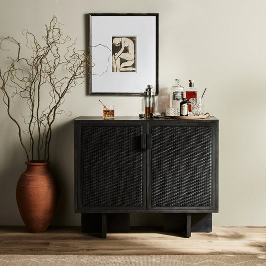Levon Bar Cabinet by Four Hands in black pine. Made from solid pine, cane in a modern style.