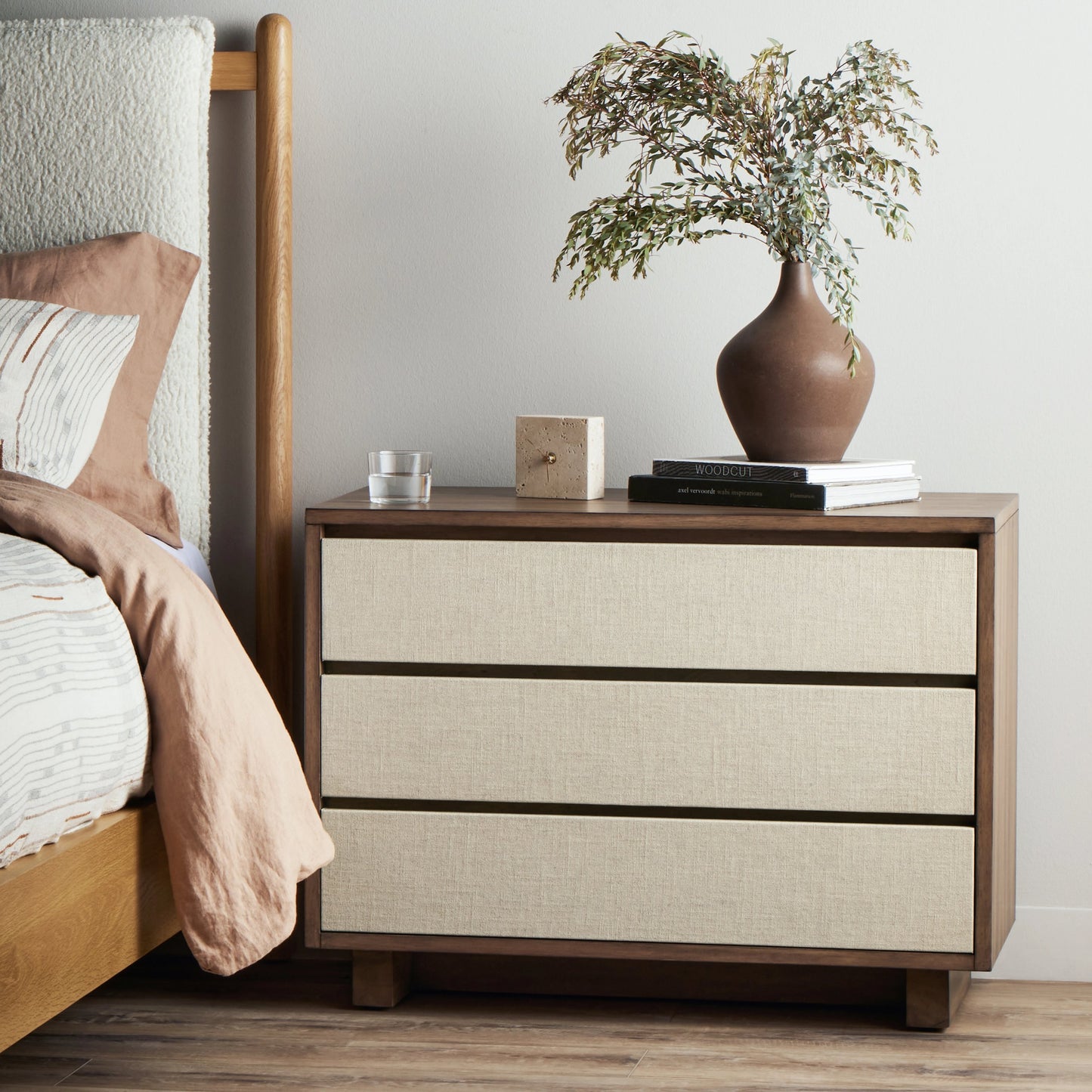 015 SI-2074340 | Lifestyle | Grove Nightstand by Four Hands in beige painted linen and russet mahogany. Made from mahogany veneer, solid mahogany, painted linen in a modern style.
