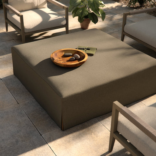 Laskin Outdoor Ottoman by Four Hands in alessi fawn and washed brown. Made from 100% polypropylene, solid fsc®-certified teak, 91% polyurethane foam pad, 9% polyester fiber batting in a modern style.