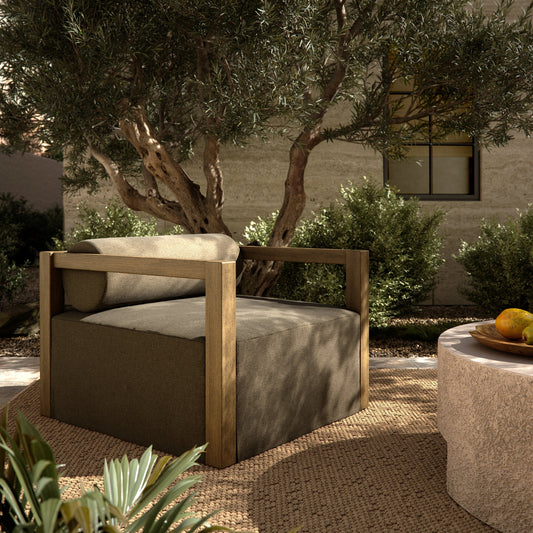 Laskin Outdoor Chair by Four Hands in alessi fawn and washed brown. Made from 100% polypropylene, solid fsc®-certified teak, 91% polyurethane foam pad, 9% polyester fiber batting in a modern style.