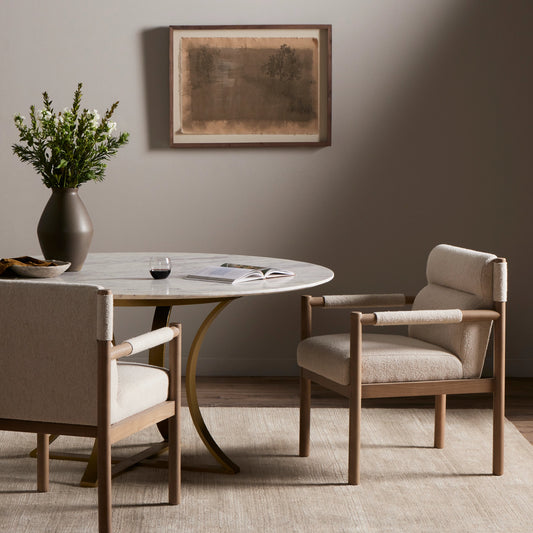 Kiano Dining Armchair by Four Hands in charter oatmeal and washed natural parawood. Made from 69% polyester, 23% acrylic, 8% flax, linen, solid parawood, 100% polyester in a modern style.