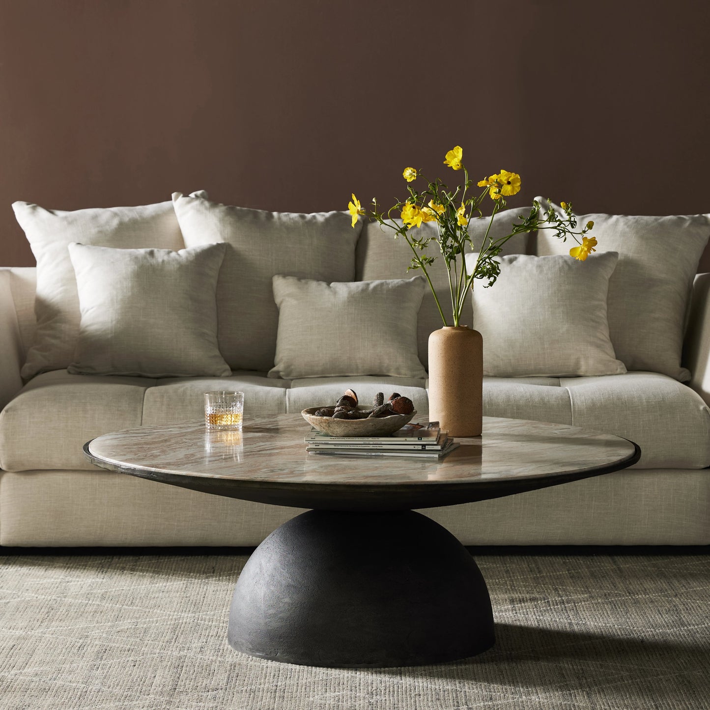 008 SI-2001136 | Lifestyle | Corbett Large Coffee Table by Four Hands in hammered grey, creamy taupe marble. Made from solid marble, aluminum, engineered hardwood in a modern style.
