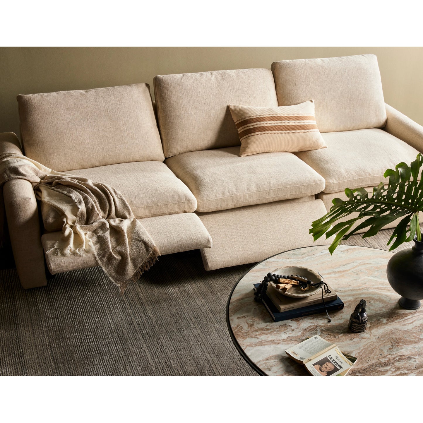 009 SI-2001136 | Lifestyle | Corbett Large Coffee Table by Four Hands in hammered grey, creamy taupe marble. Made from solid marble, aluminum, engineered hardwood in a modern style.
