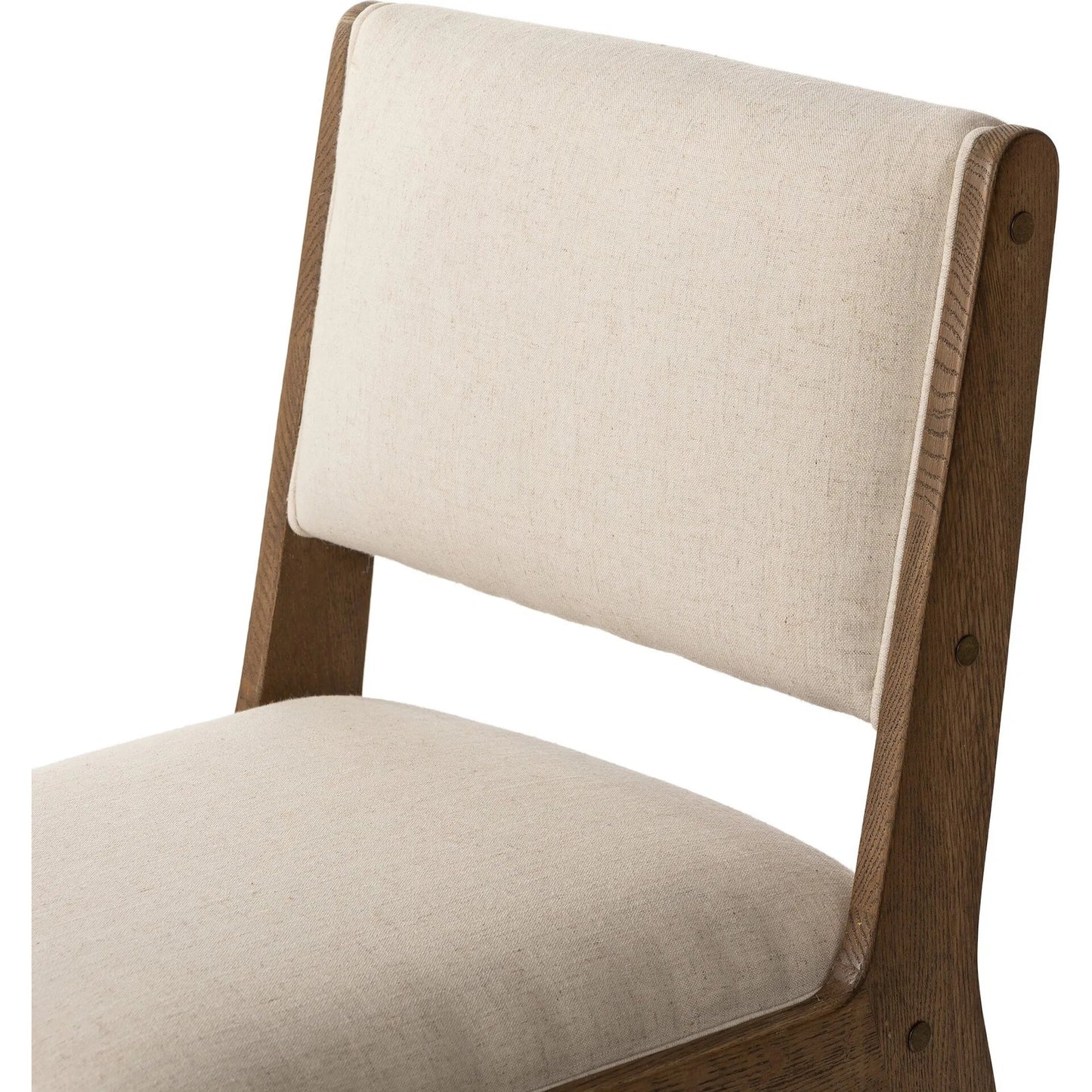 009 SI-2320196 | Closeup | Norwalk Dining Chair by Four Hands in savile flax, lamont oak, antique brass. Made from 92% polyester, 8% flax/linen, solid oak, stainless steel in a unique style.