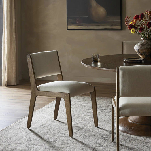 Norwalk Dining Chair by Four Hands in savile flax, lamont oak, antique brass. Made from 92% polyester, 8% flax/linen, solid oak, stainless steel in a transitional style.