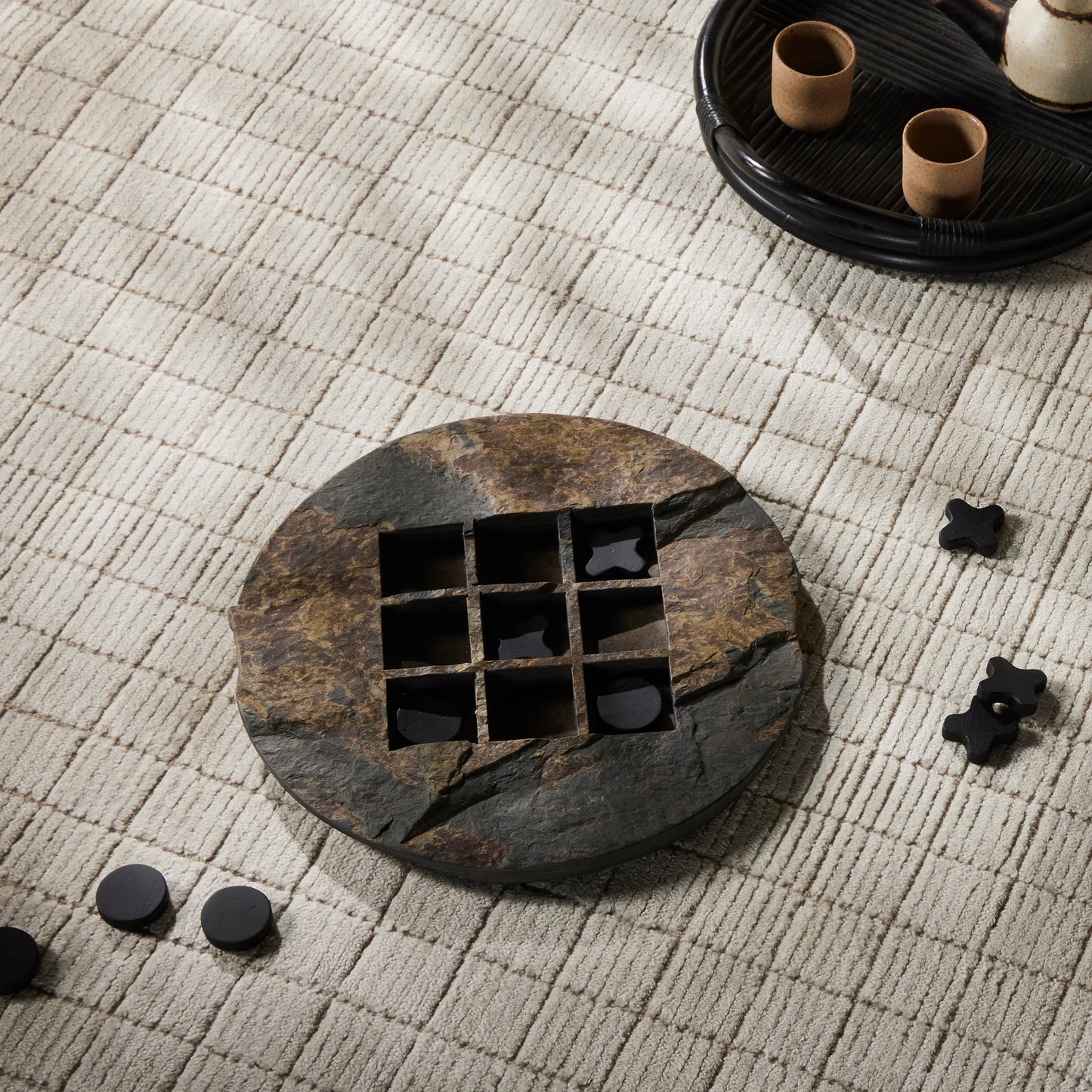 007 SI-2001964 | Lifestyle | Stone Tic Tac Toe by Four Hands in grey stone, aged metal, carbonized black. Made from slate flagstone solid, solid mixed reclaimed wood, iron in a rustic style.