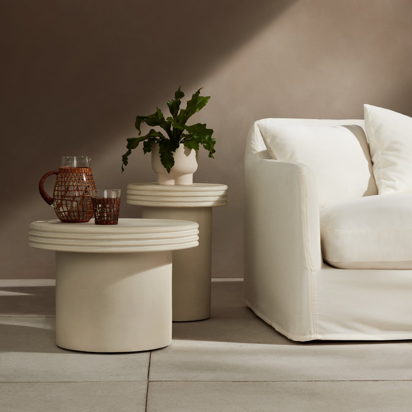 009 SI-1902492 | Lifestyle | Grecia Outdoor End Table Set by Four Hands in white. Made from concrete in a modern style.