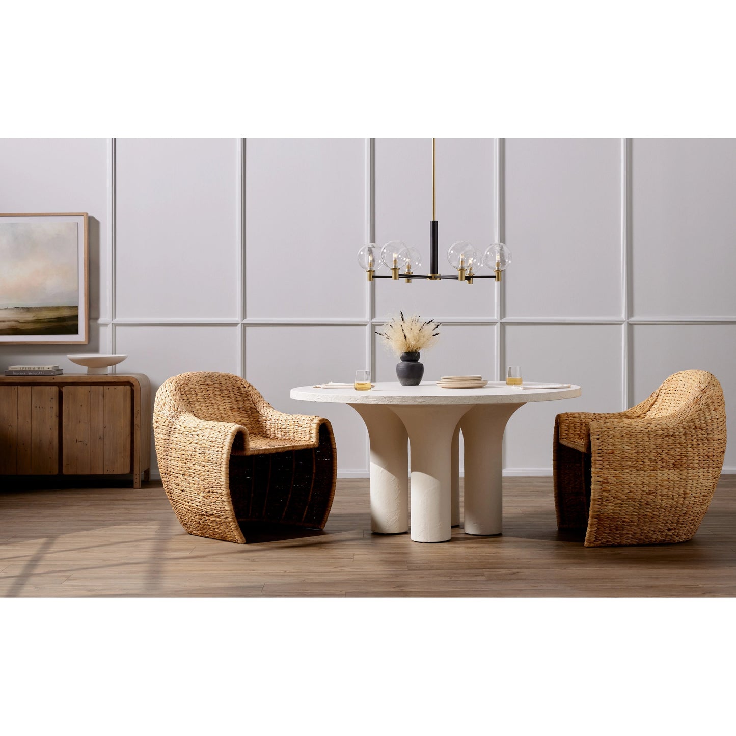 003 SI-1977675 | Lifestyle | Parra Round Dining Table by Four Hands in white plaster molded concrete. Made from concrete in a modern style.
