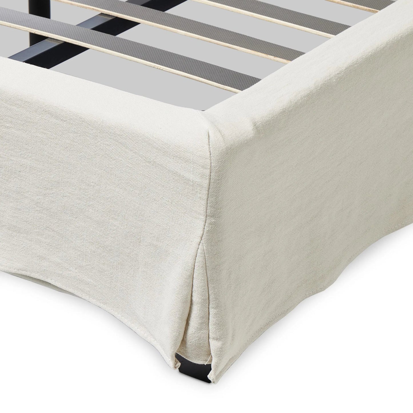 016 SI-2320168,SI-2320169 | Closeup | Meryl Slipcover Bed by Four Hands in broadway mist, black parawood. Made from 100% flax/linen, solid parawood in a unique style.