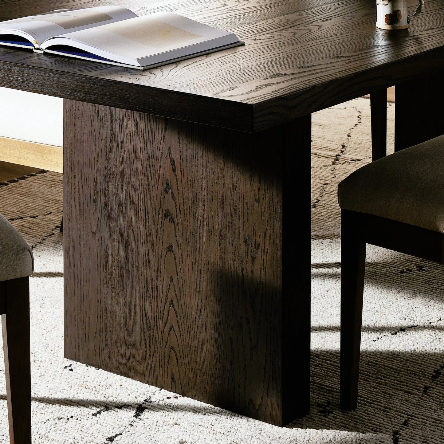 011 SI-2158554 | Closeup | Torrington Dining Table by Four Hands in umber oak, umber oak veneer and umber oak. Made from resawn oak, oak veneer, engineered hardwood in a modern style.