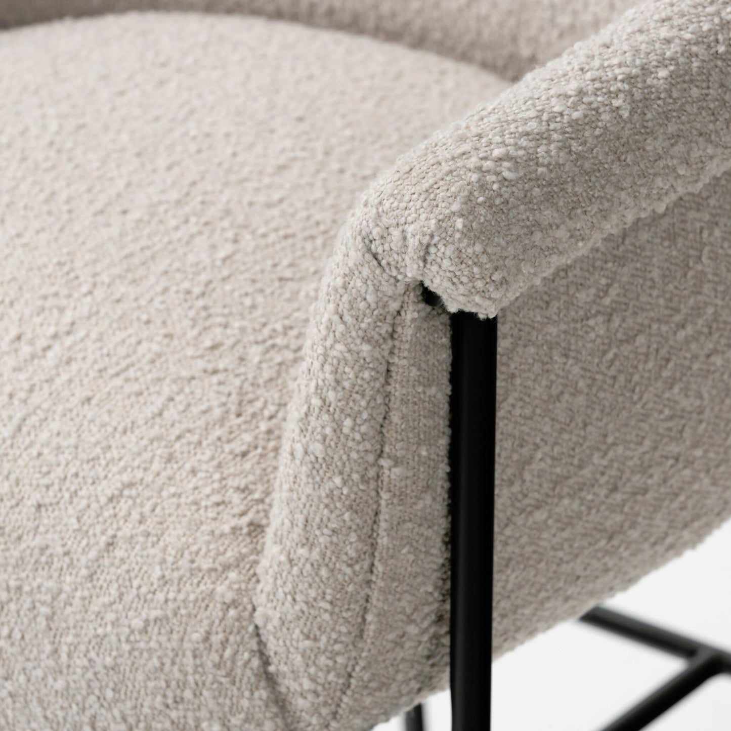 006 SI-2158510 | Closeup | Suerte Bar + Counter Stool by Four Hands in knoll sand, matte ebony and knoll sand. Made from 95% polyester, 5% acrylic, iron, 100% polyester in a modern style.