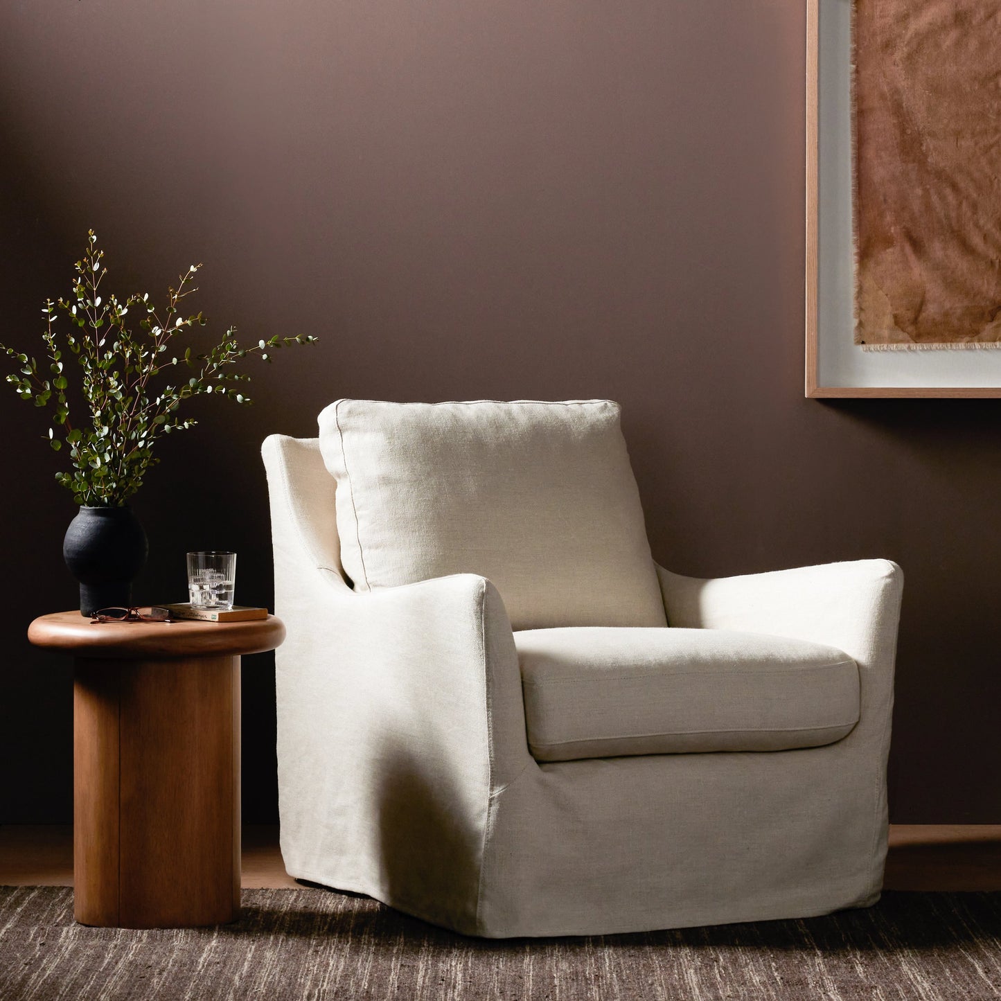 012 SI-1980592 | Lifestyle | Monette Slipcover Swivel Chair by Four Hands in brussels natural. Made from 100% flax, linen, poplar plywood, 100% polyester in a modern style.
