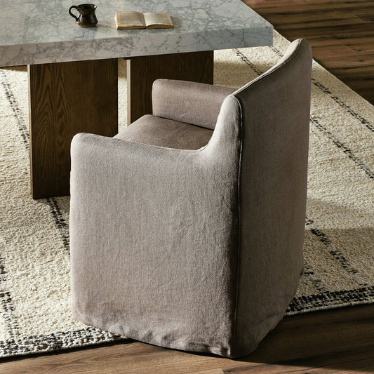 Westcott Slipcover Dining Chair by Four Hands in brussels mushroom. Made from 100% flax/linen, 80% polyurethane foam, 20% fiber, 100% polyester in a modern style.