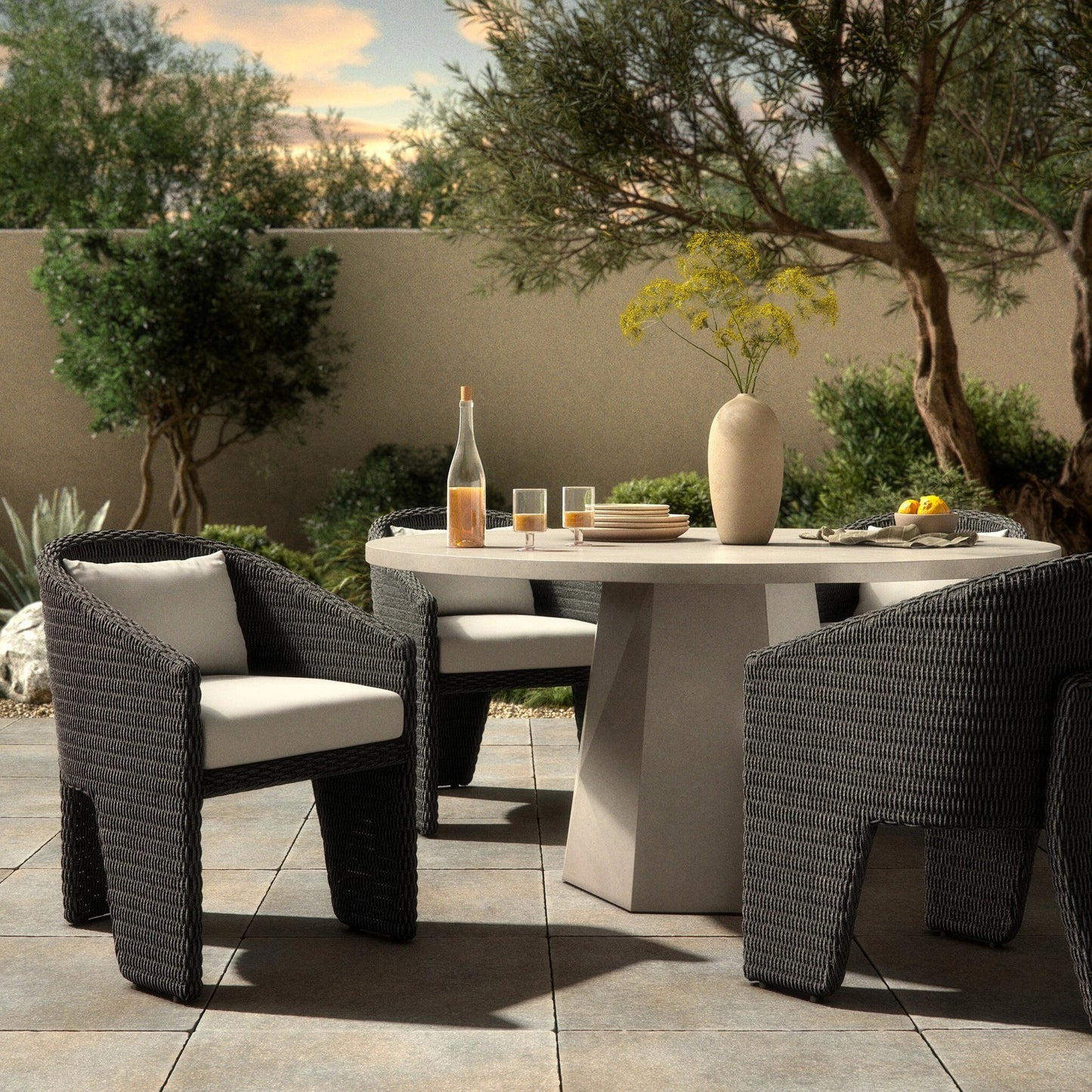 045 SI-2137317 | Lifestyle | Fae Outdoor Dining Chair by Four Hands in stinson white. Made from 100% olefin, 100% polyethylene in a modern style.