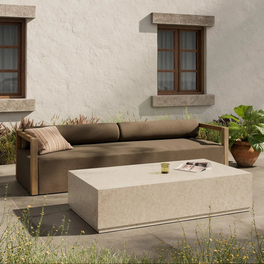 Oakland Outdoor Rectangular Coffee Table by Four Hands in outdoor cream marble. Made from solid marble in a transitional style.