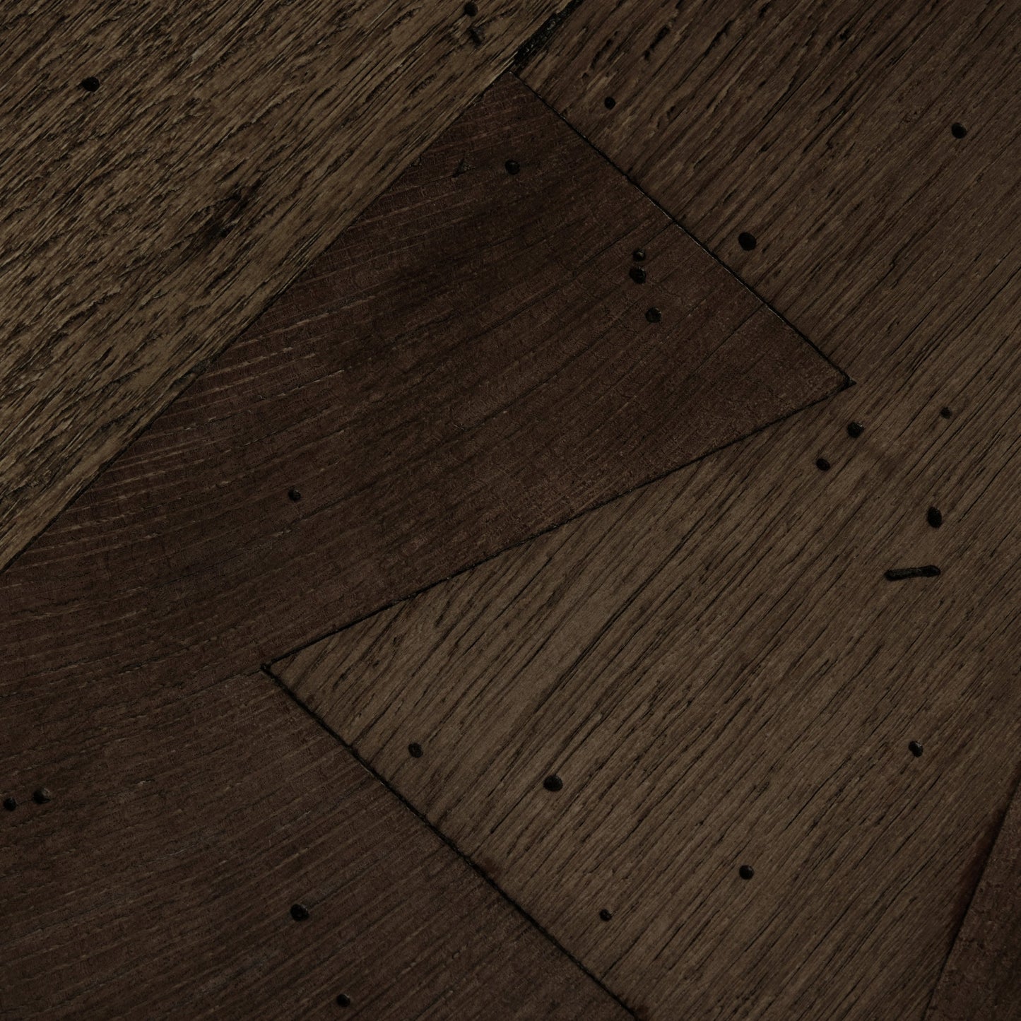 018 SI-2000881 | Closeup | Abaso Small Square Coffee Table by Four Hands in ebony rustic wormwood oak. Made from thick oak veneer, engineered hardwood in a modern style.