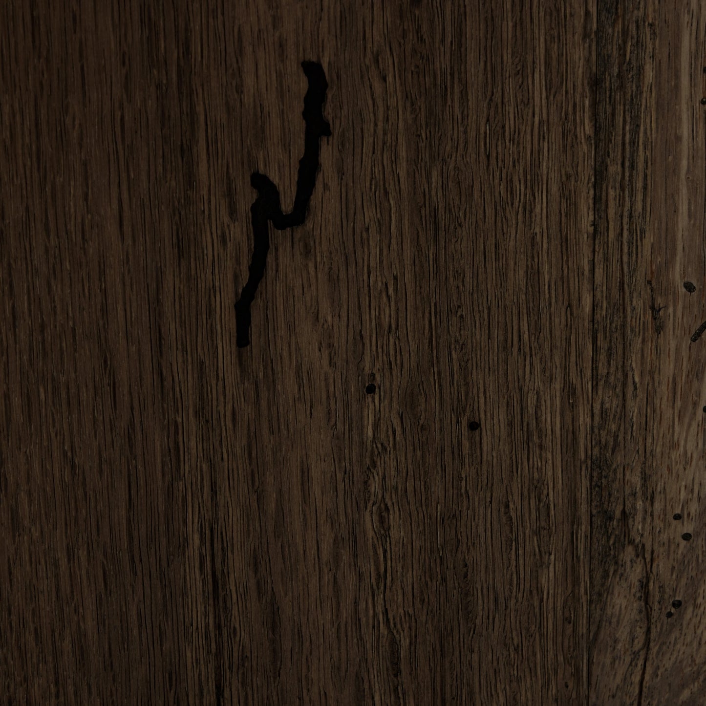 005 SI-2000875 | Closeup | Abaso Large Accent Bench by Four Hands in ebony rustic wormwood oak. Made from thick oak veneer, engineered hardwood in a modern style.