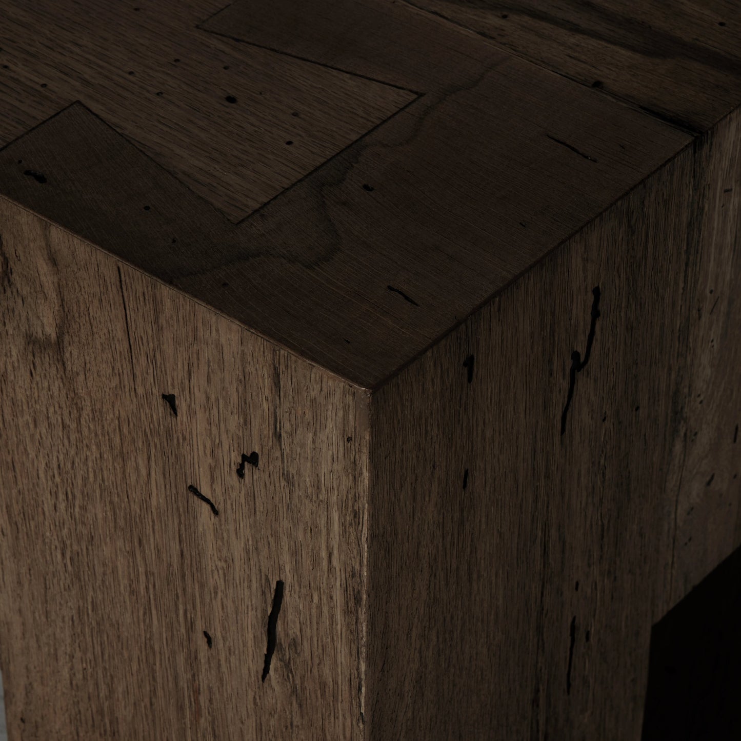 007 SI-2000875 | Closeup | Abaso Large Accent Bench by Four Hands in ebony rustic wormwood oak. Made from thick oak veneer, engineered hardwood in a modern style.