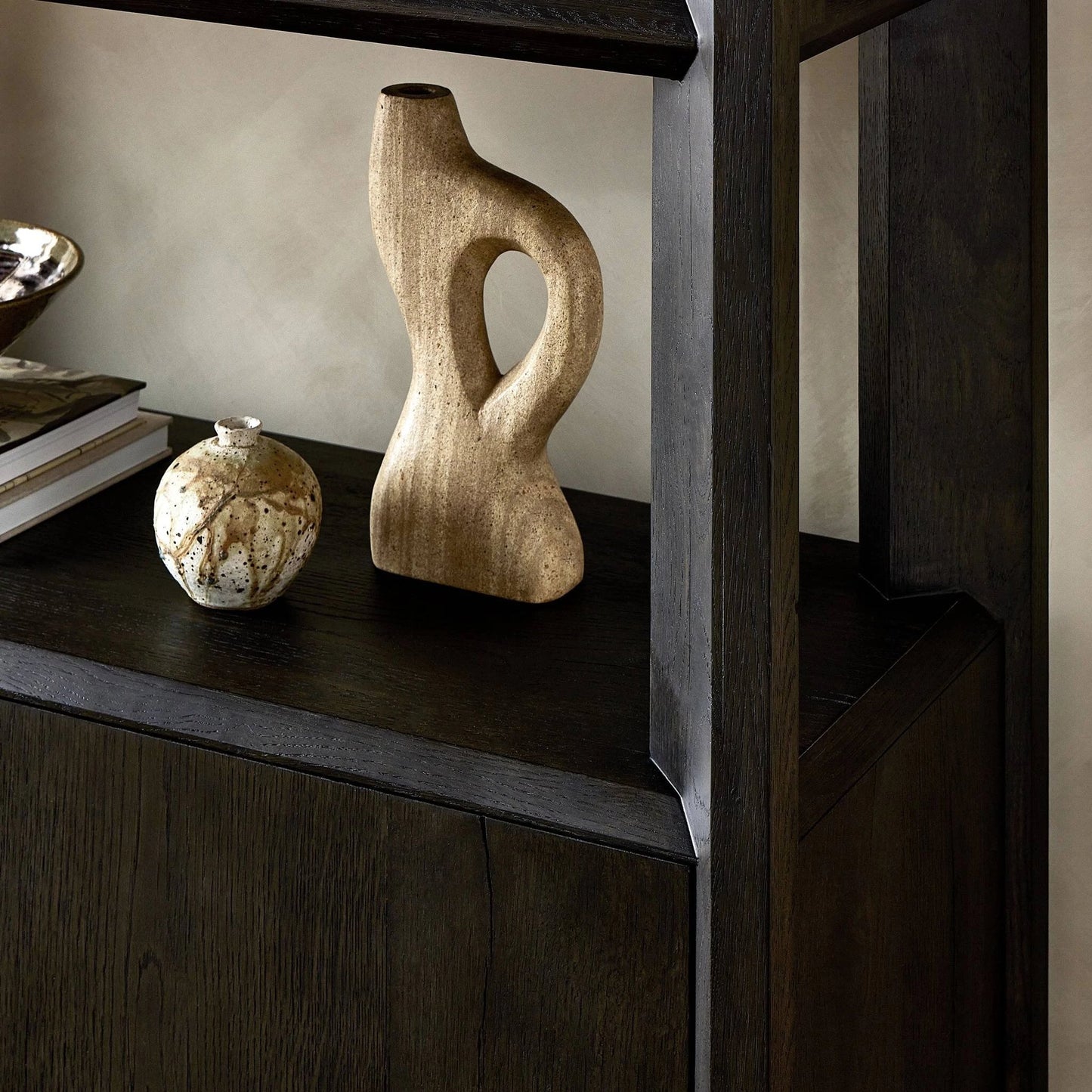 009 SI-2137546 | Closeup | Orwin Bookshelf by Four Hands in smoked black oak. Made from solid oak, thick oak veneer in a modern style.