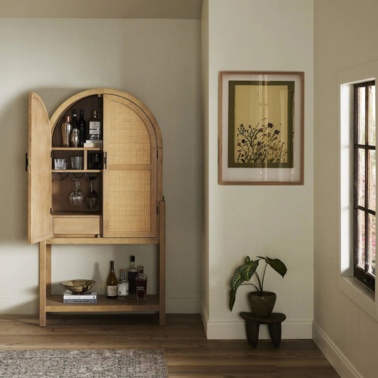 Dulane Bar Cabinet by Four Hands in light natural parawood veneer. Made from parawood veneer, cane, engineered hardwood in a transitional style.