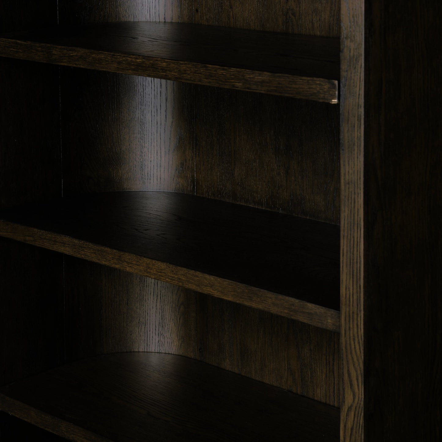 006 SI-2158281 | Closeup | Lockhart Bookcase by Four Hands in rubbed black oak solid, rubbed black veneer and rubbed black oak solid. Made from solid oak, oak veneer in a modern style.