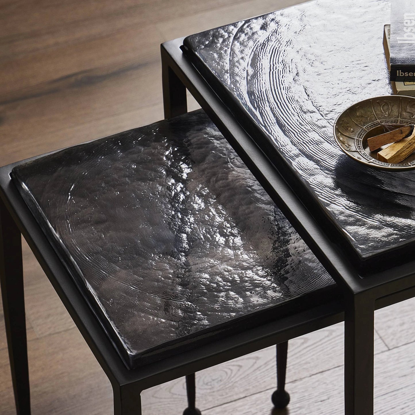 009 SI-2137287 | Closeup | Dalston Cast Glass Nesting Tables by Four Hands in smoked black cast glass, iron matte black. Made from cast glass, iron in a modern style.