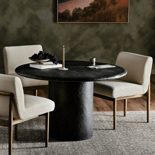 Bonnie Dining Table by Four Hands in textured black concrete. Made from concrete in a modern style.