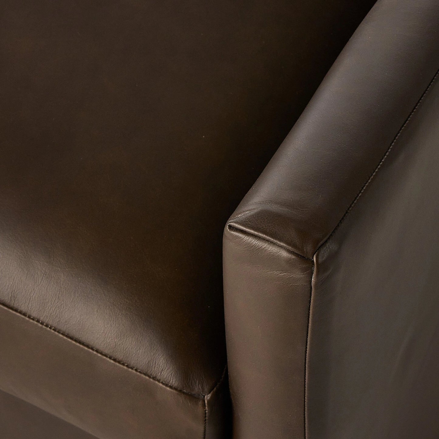 005 SI-2137517 | Closeup | Miriam Swivel Chair by Four Hands in heirloom cigar. Made from top grain leather, pine plywood, solid pine in a modern style.
