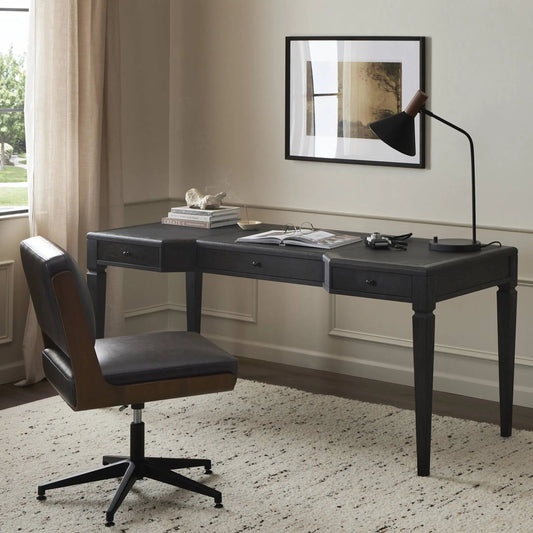 Claude Desk by Four Hands in distressed black oak veneer, bosa black. Made from oak veneer, top grain leather, solid oak in a modern style.