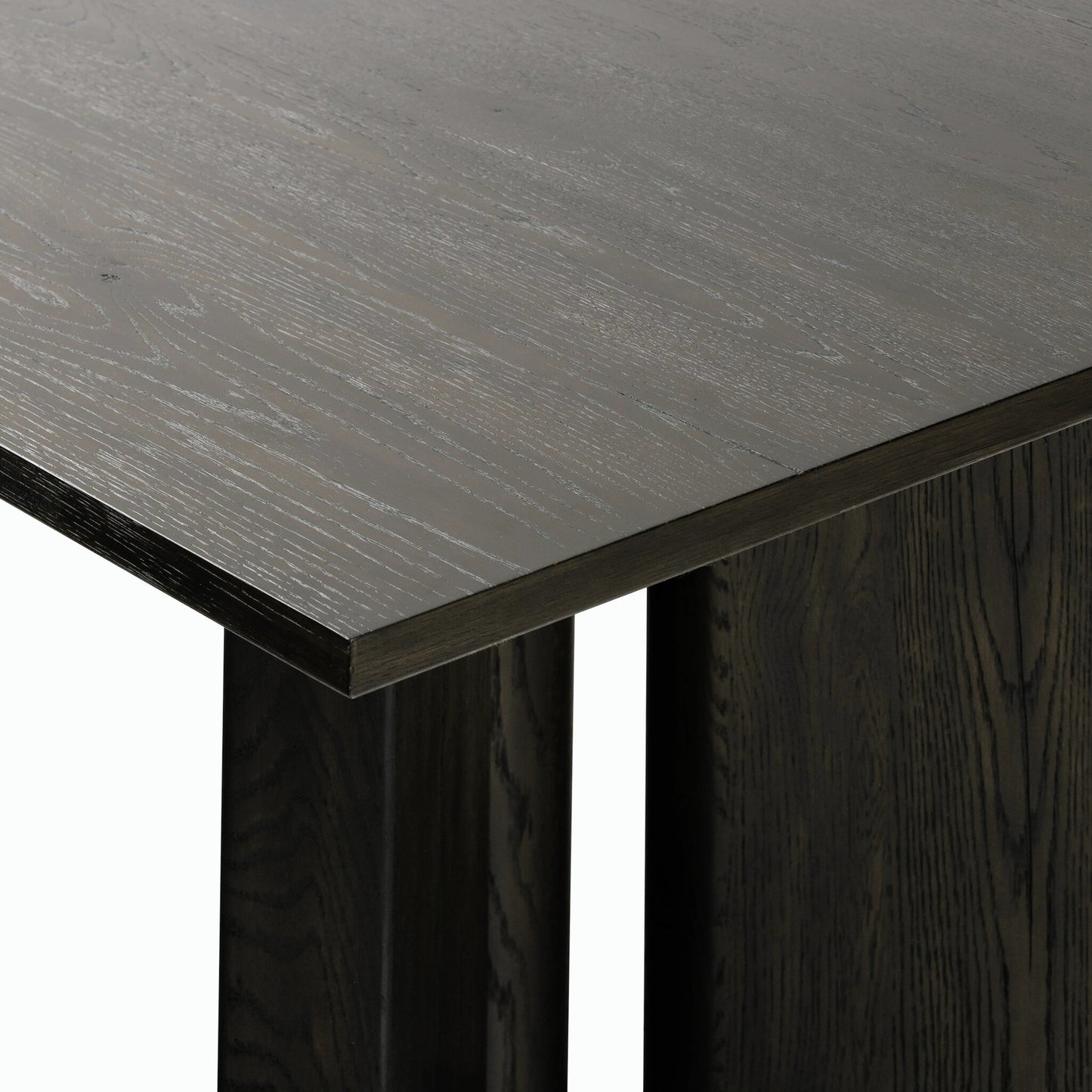 005 SI-2158206 | Closeup | Huxley Dining Table 84" by Four Hands in smoked black veneer. Made from thick oak veneer, solid oak in a modern style.