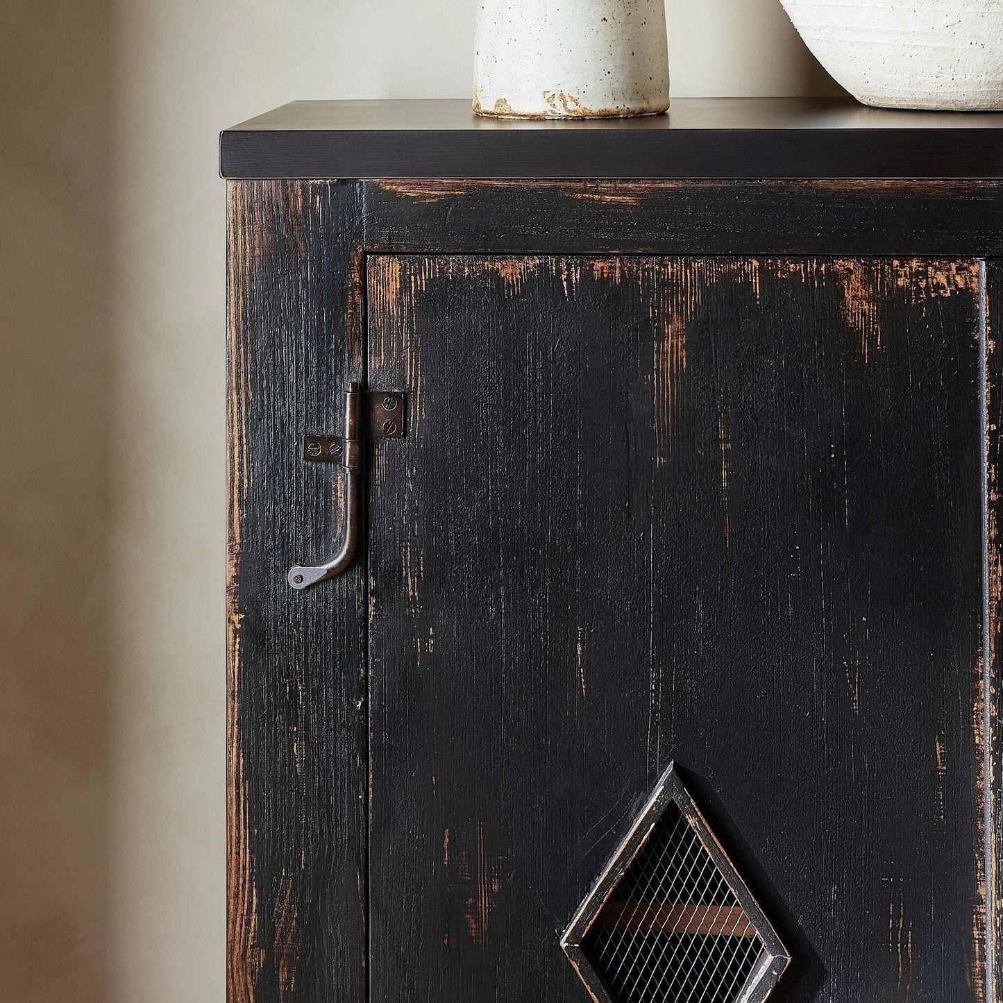 008 SI-2137641 | Closeup | The Humptulips River Moonshine Cabinet by Four Hands in distressed burnt black. Made from pine veneer, solid pine in a modern style.