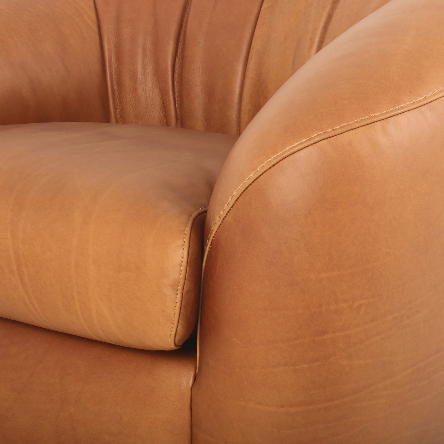 008 SI-2449410 | Closeup | Saldana Swivel Chair by Four Hands in lorento cognac. Made from top grain leather in a unique style.