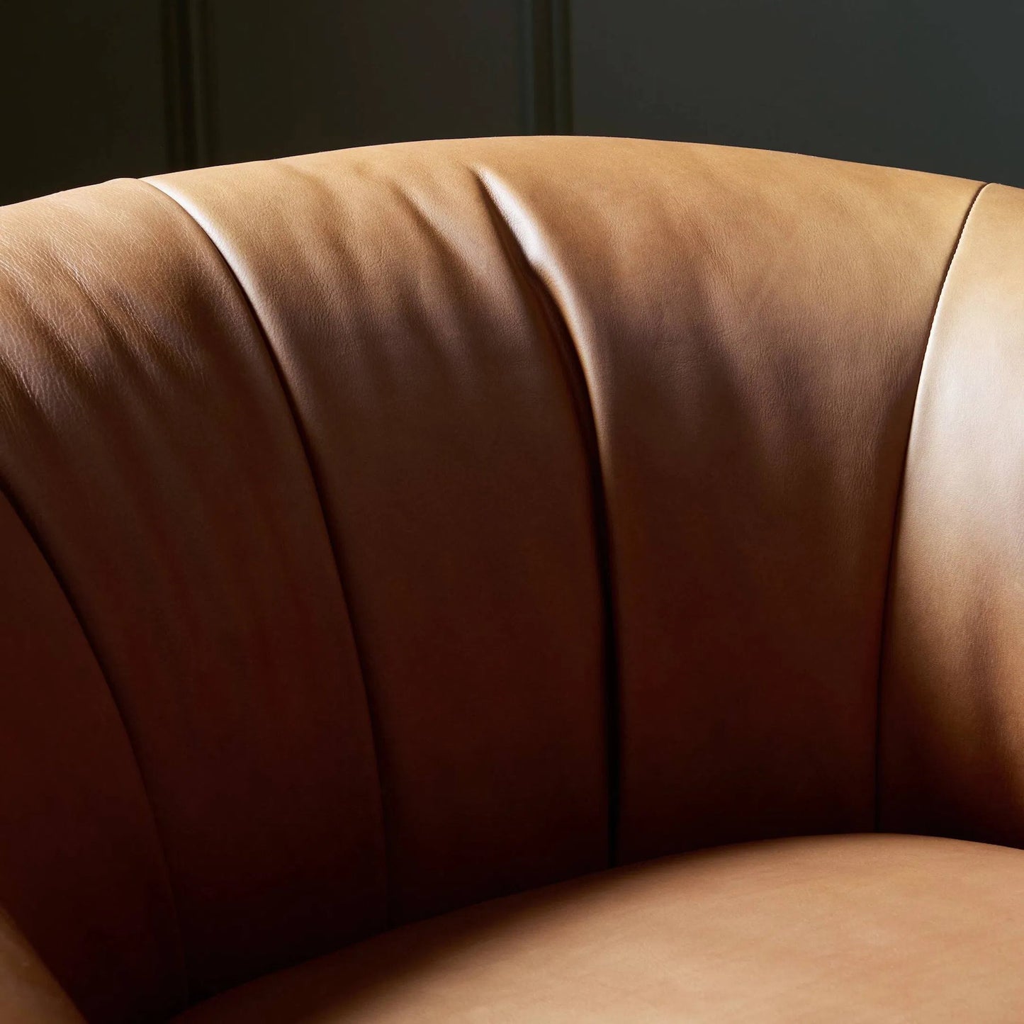 011 SI-2449410 | Closeup | Saldana Swivel Chair by Four Hands in lorento cognac. Made from top grain leather in a unique style.