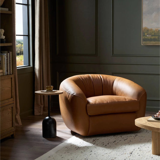 Saldana Swivel Chair by Four Hands in lorento cognac. Made from top grain leather in a traditional style.
