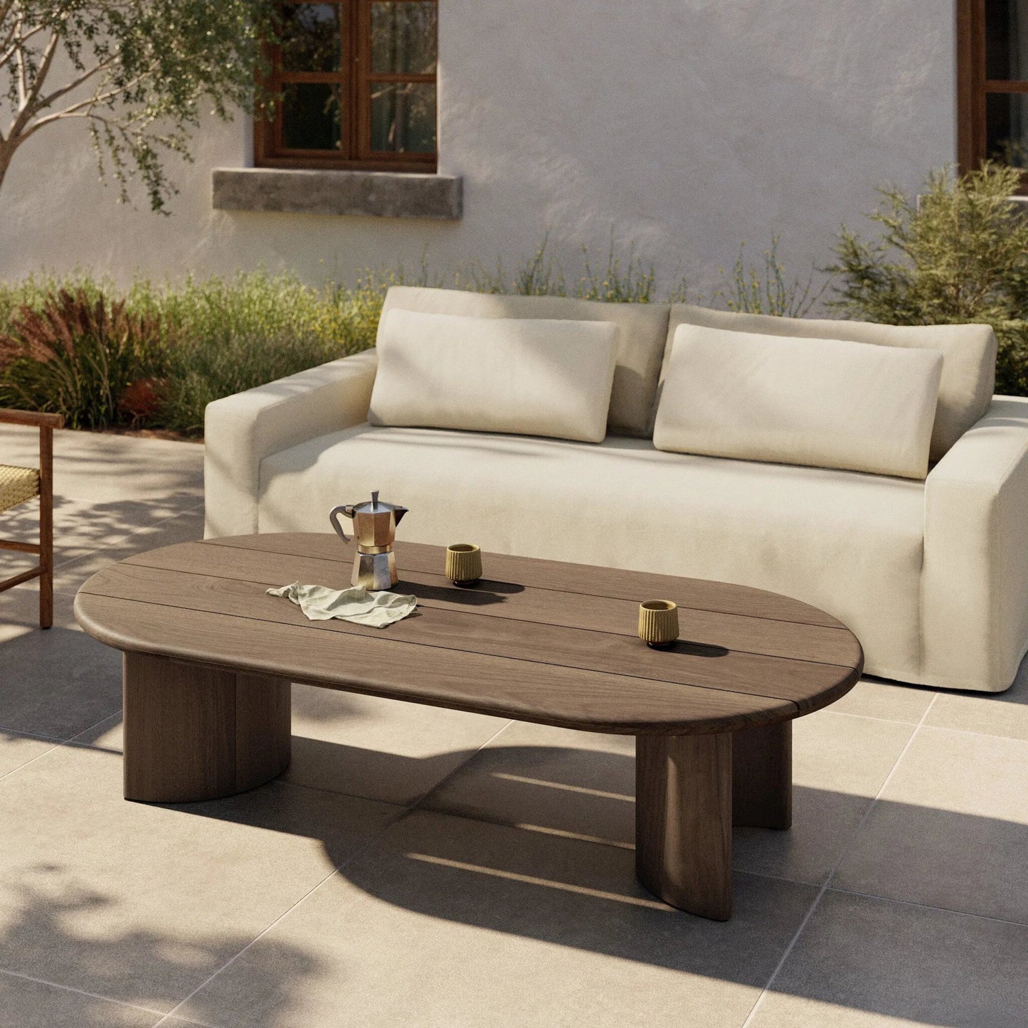 012 SI-2320210 | Lifestyle | Paden Outdoor Coffee Table by Four Hands in stained toasted brown-fsc. Made from solid fsc®-certified teak in a transitional style.