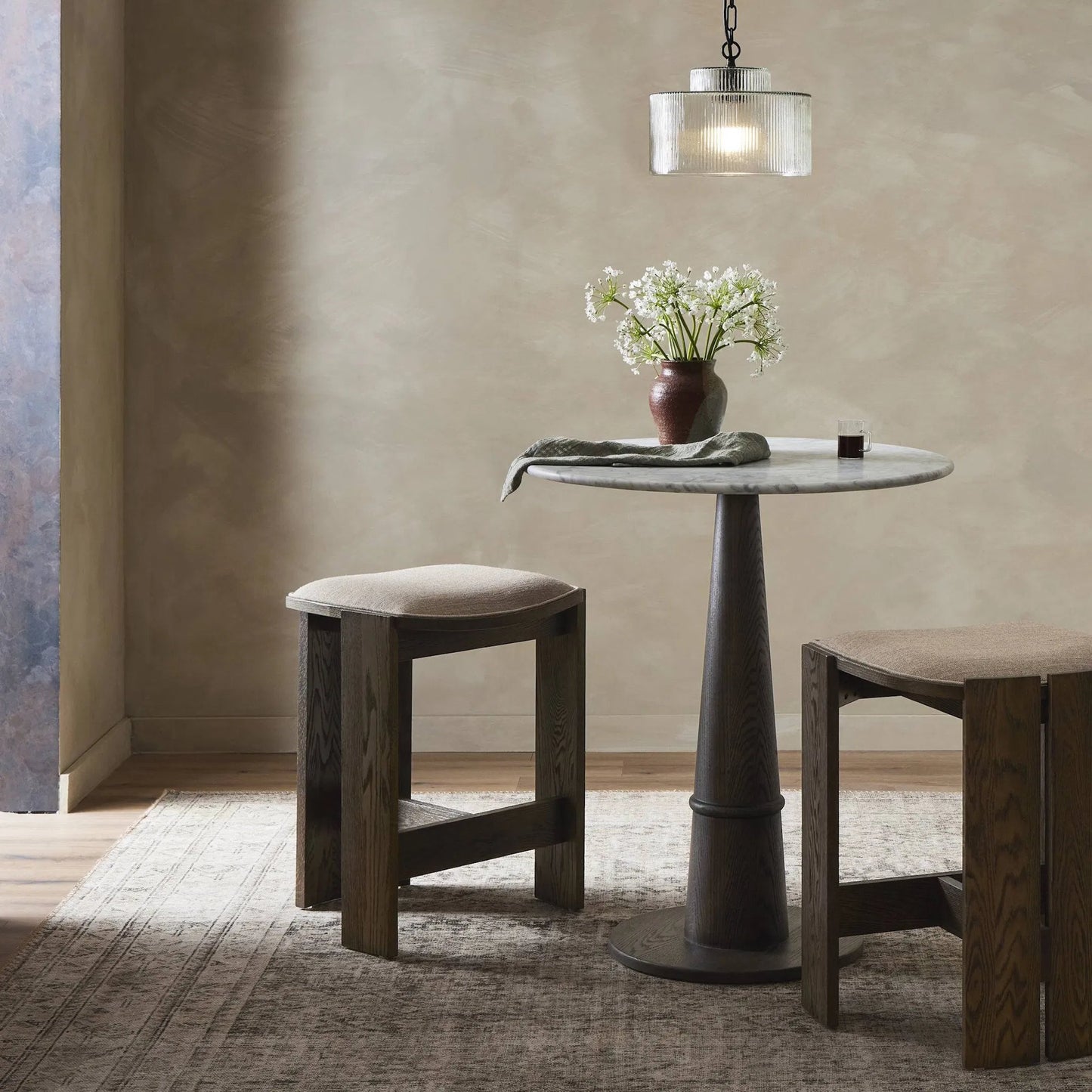 010 SI-2320119 | Lifestyle | Hoven Backless Bar Stool by Four Hands in alcala fawn, drifted oak. Made from 70% polyester, 20% viscose (rayon), 10% flax/linen, solid oak in a transitional style.