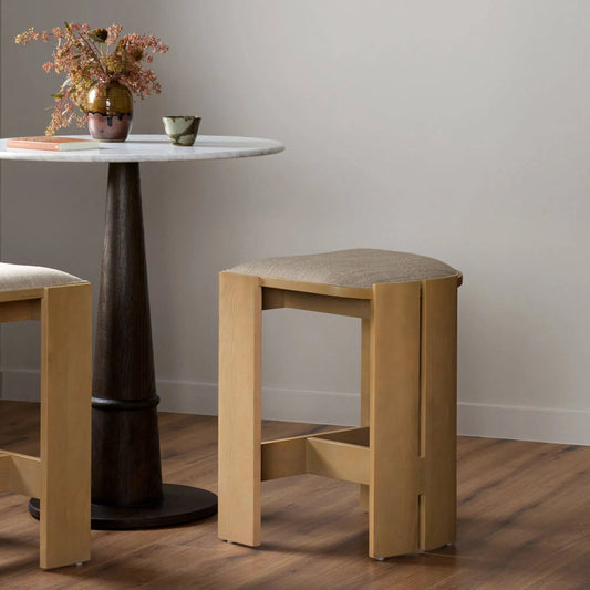 Hoven Backless Stool by Four Hands in alcala wheat, light ash. Made from 70% polyester, 20% viscose (rayon), 10% flax, linen, solid ash in a unique style.