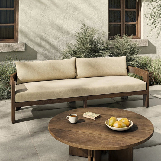 Jackson Outdoor Sofa by Four Hands. Made from 100% olefin, solid fsc®-certified teak, 91% polyurethane foam pad, 9% polyester fiber batting in a modern style.